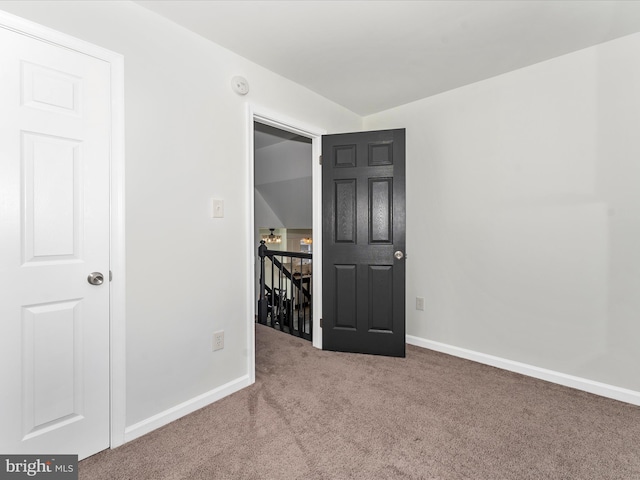 unfurnished room with carpet floors