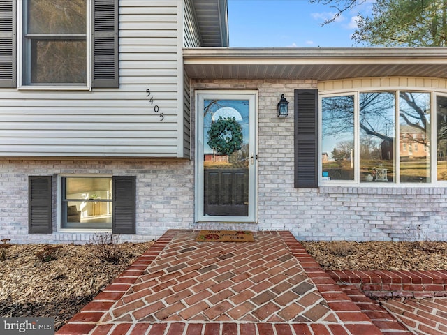 property entrance featuring a patio