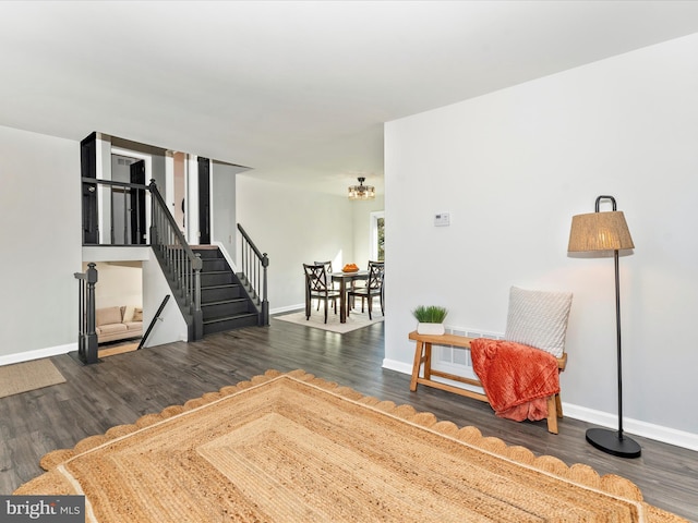 living area with dark wood-type flooring