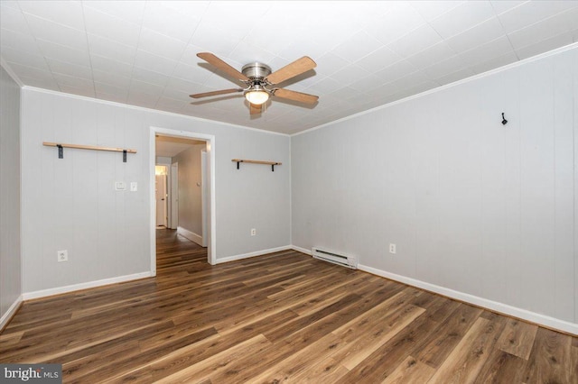 empty room with ornamental molding, ceiling fan, wood finished floors, and a baseboard radiator
