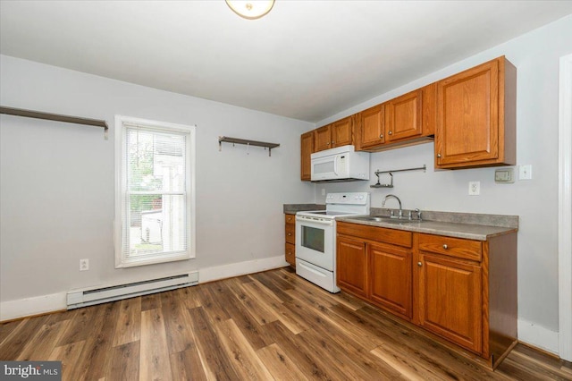 kitchen featuring white appliances, a baseboard radiator, brown cabinets, a sink, and dark wood-type flooring
