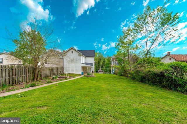 view of yard with a fenced backyard