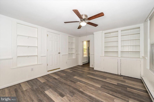 interior space featuring a baseboard heating unit, a ceiling fan, baseboard heating, and dark wood finished floors