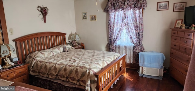 bedroom featuring dark hardwood / wood-style floors