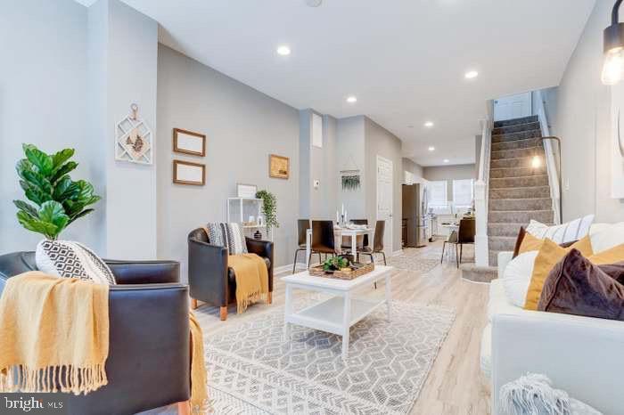 living room featuring light wood-type flooring