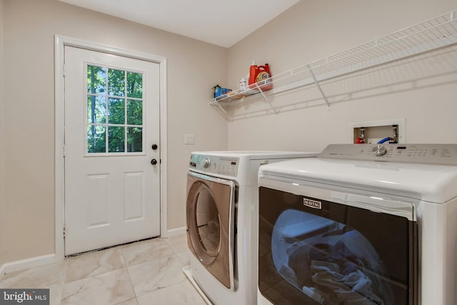 washroom featuring washing machine and dryer