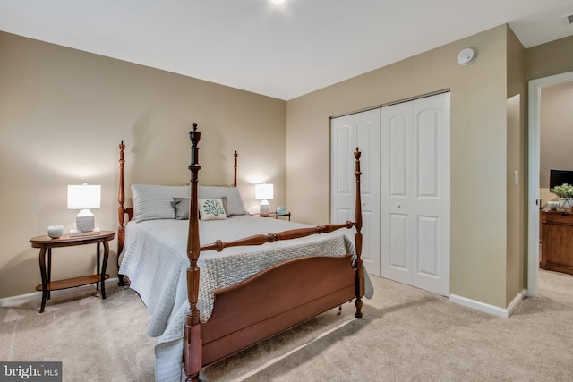 carpeted bedroom featuring a closet