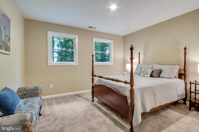 bedroom featuring light colored carpet