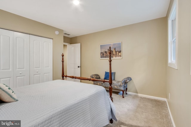 carpeted bedroom featuring a closet