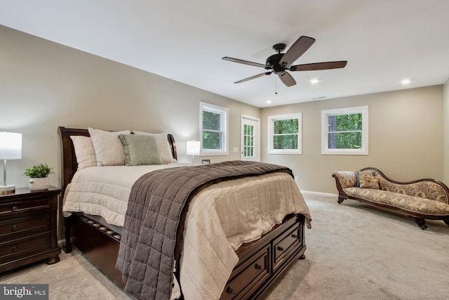 bedroom featuring ceiling fan and light carpet