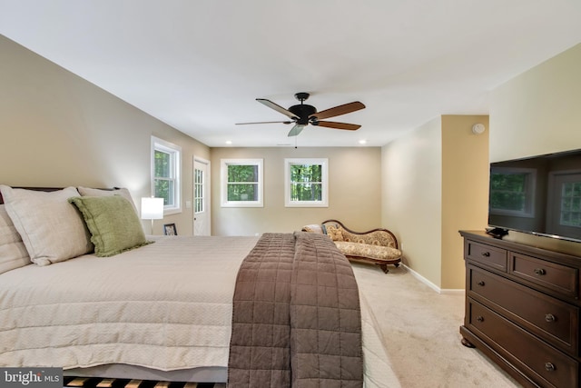 bedroom featuring ceiling fan and light colored carpet