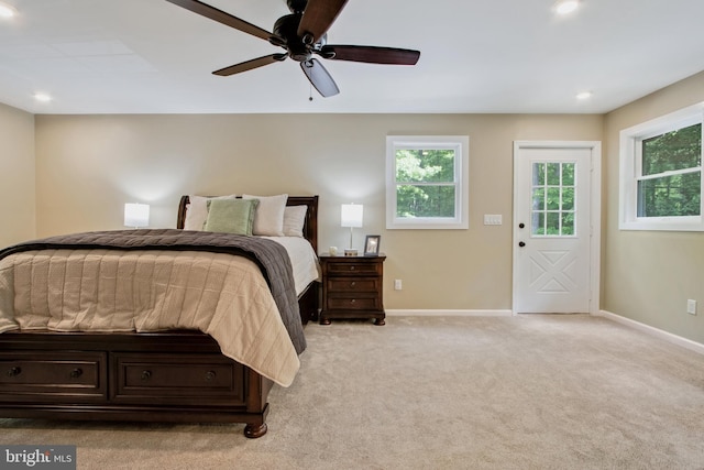 bedroom with light carpet and ceiling fan