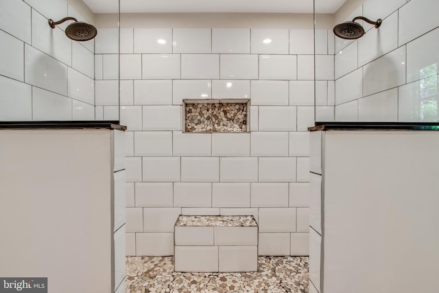 bathroom with a tile shower