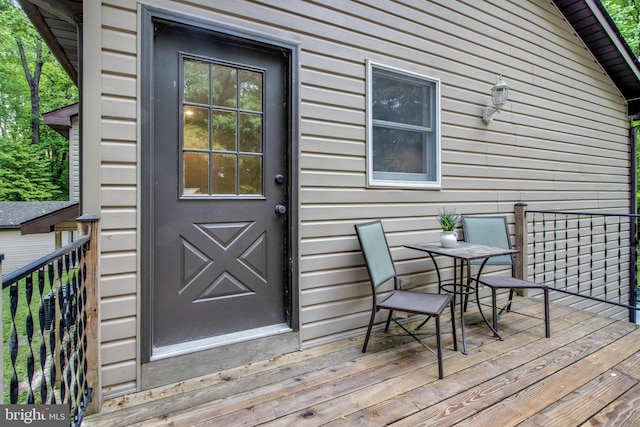 doorway to property featuring a wooden deck