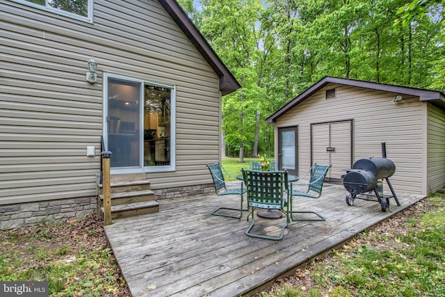 wooden deck featuring area for grilling