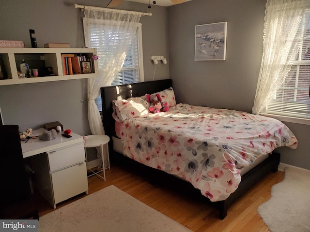 bedroom with hardwood / wood-style floors