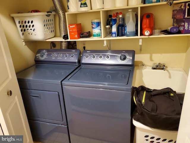 laundry room with washer and clothes dryer