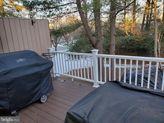 wooden terrace featuring grilling area