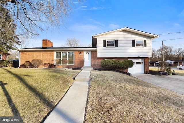 split level home featuring a garage and a front yard