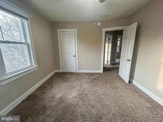 unfurnished bedroom with carpet