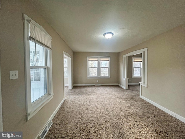 unfurnished room featuring carpet floors