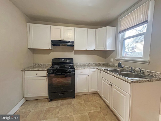 kitchen with white cabinetry, black gas range oven, and sink