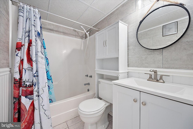 full bathroom with shower / bath combination with curtain, vanity, toilet, and tile patterned flooring