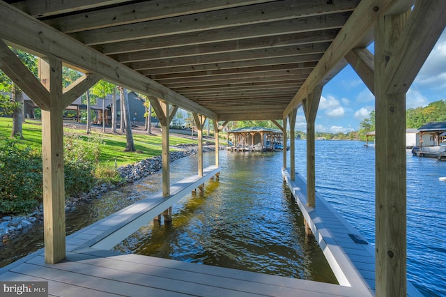 dock area featuring a water view and boat lift