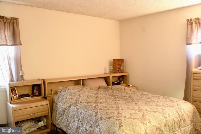 bedroom featuring a textured ceiling