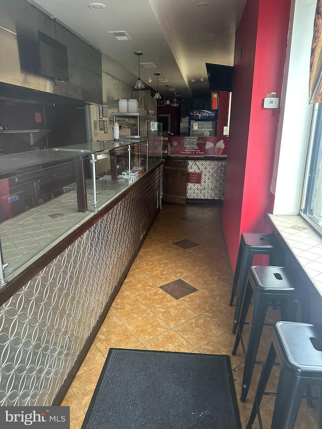 kitchen with light tile patterned floors