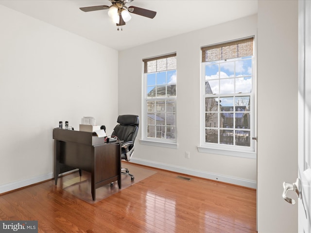 office area with wood-type flooring and ceiling fan