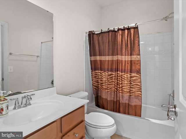 full bathroom featuring vanity, shower / tub combo with curtain, and toilet