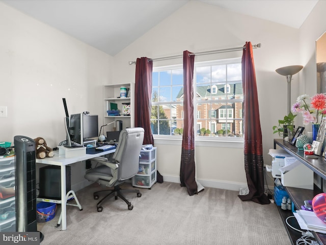 carpeted office space with lofted ceiling