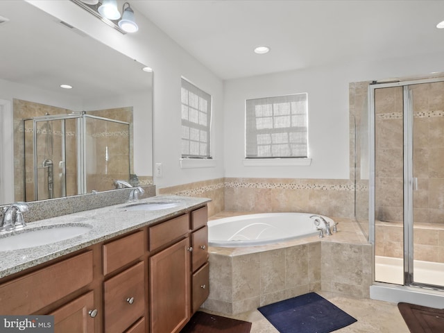 bathroom featuring independent shower and bath and vanity