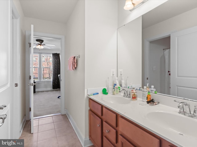 bathroom featuring tile patterned flooring, vanity, and ceiling fan