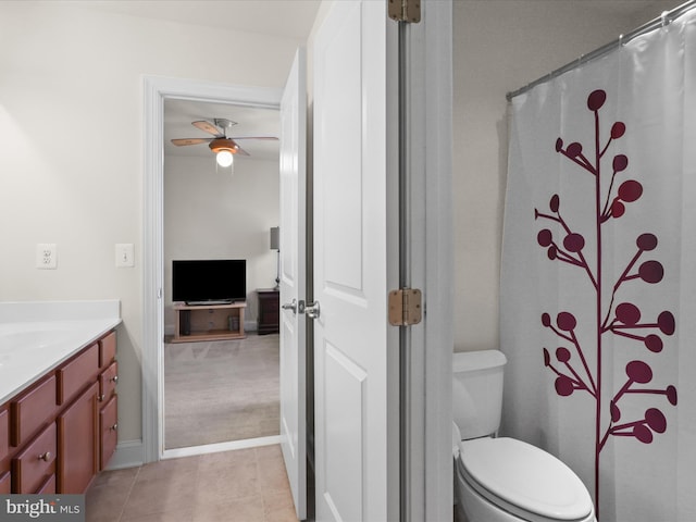 bathroom featuring vanity, tile patterned floors, ceiling fan, and toilet