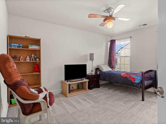 carpeted bedroom featuring ceiling fan