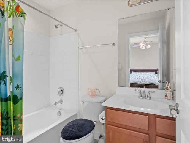 full bathroom with ceiling fan, vanity, toilet, and shower / tub combo