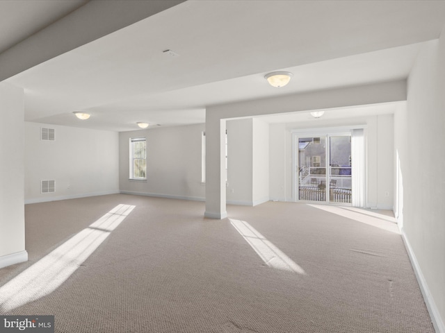 unfurnished room with light carpet