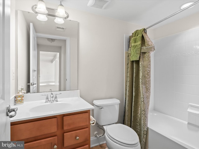 full bathroom with vanity, toilet, and shower / tub combo