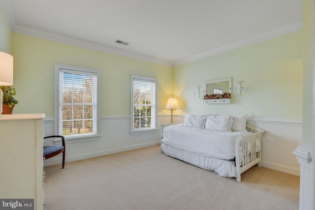 bedroom with light carpet and crown molding