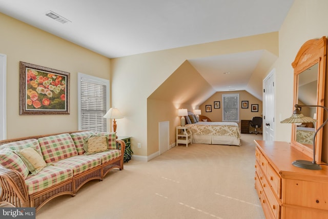 carpeted bedroom with vaulted ceiling