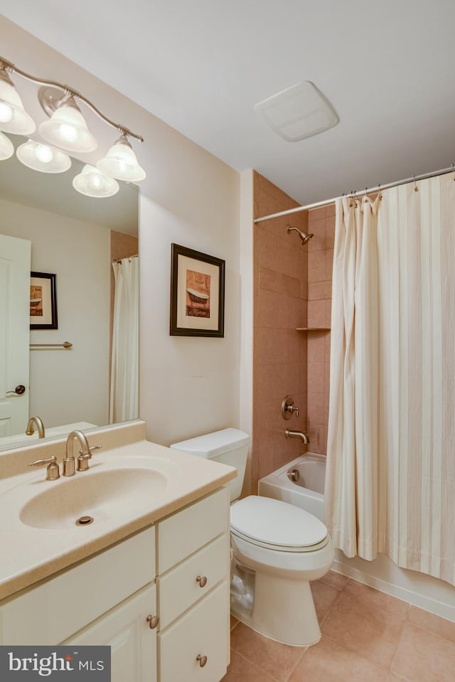 full bathroom with vanity, shower / bath combination with curtain, tile patterned floors, and toilet