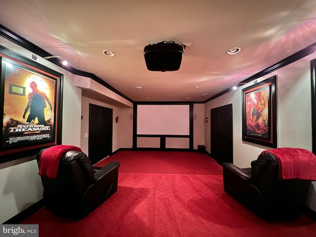 cinema with crown molding and carpet floors