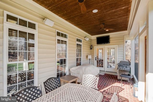 sunroom featuring wooden ceiling