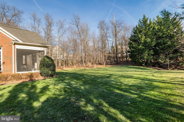 view of yard with a sunroom