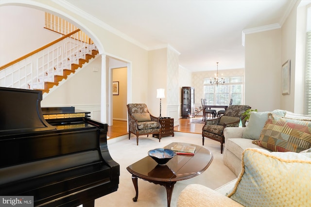 living room featuring a notable chandelier and crown molding