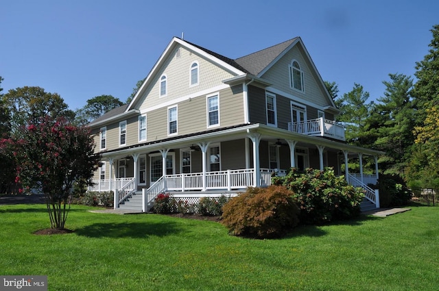 view of front of home featuring covered porch and a front lawn