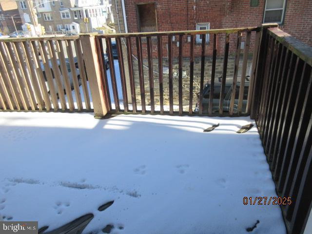 view of snow covered deck