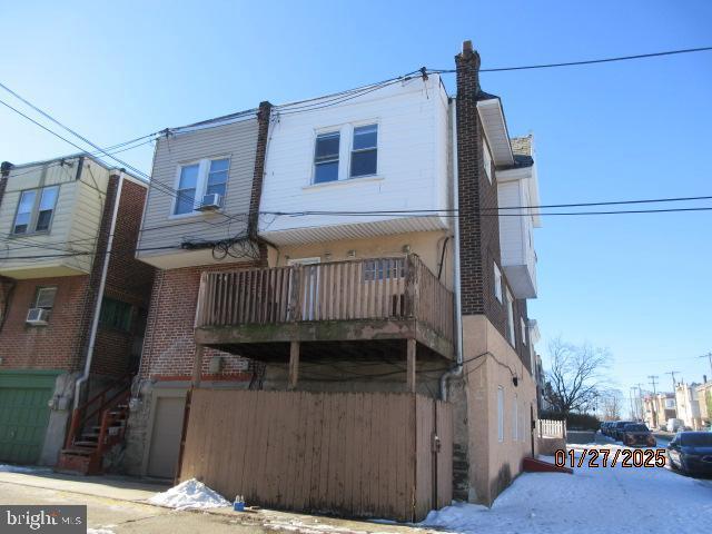 back of house with a balcony